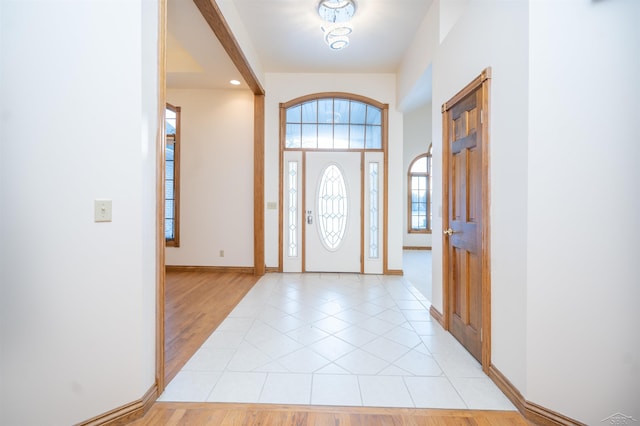 foyer entrance with light tile patterned flooring