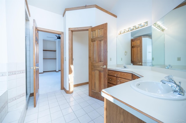 bathroom featuring ceiling fan, tile patterned flooring, and vanity