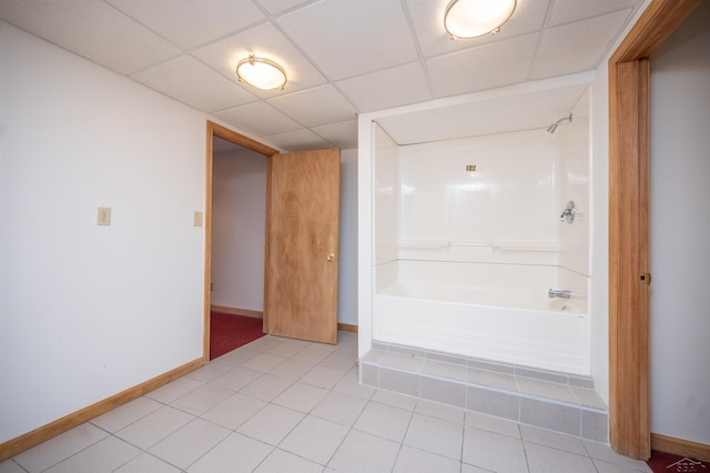 bathroom with tile patterned flooring and  shower combination