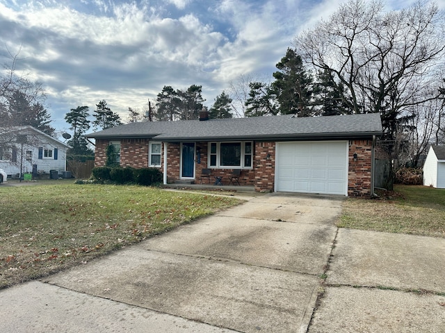 ranch-style home with a front lawn and a garage