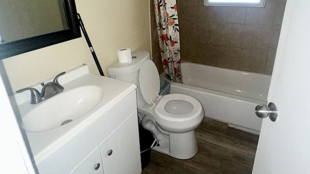 full bathroom featuring hardwood / wood-style floors, vanity, shower / bath combination with curtain, and toilet