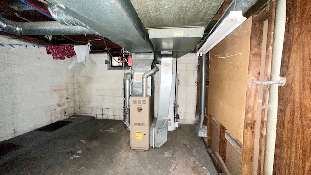 utility room featuring heating unit