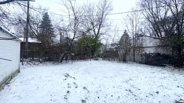 view of yard covered in snow