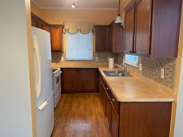 kitchen with sink, dark wood-type flooring, white fridge, stainless steel electric range, and decorative light fixtures