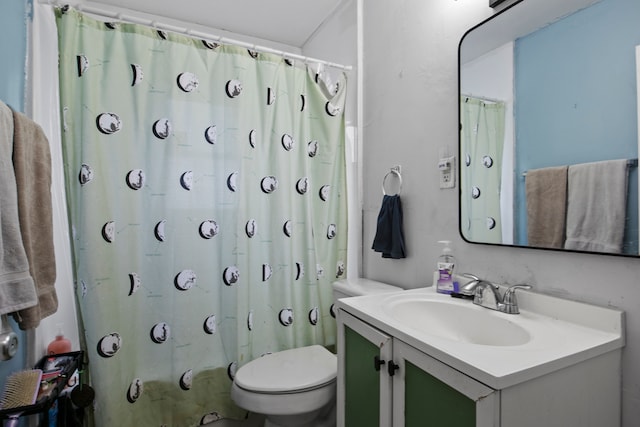 bathroom with a shower with curtain, vanity, and toilet