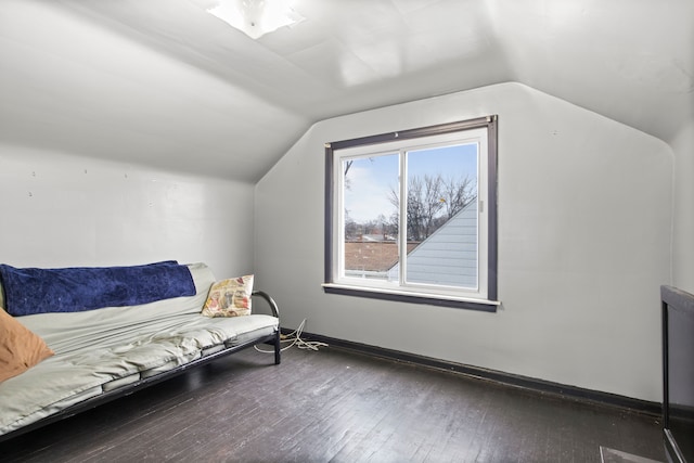 sitting room with dark hardwood / wood-style flooring and lofted ceiling