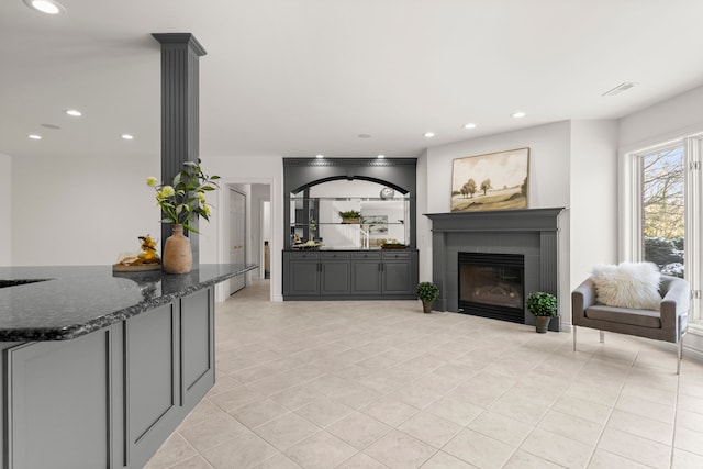 tiled living room with decorative columns