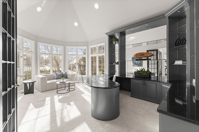 sunroom featuring lofted ceiling