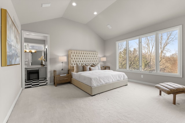 bedroom with carpet and vaulted ceiling