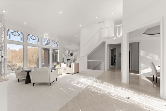 tiled living room with a towering ceiling