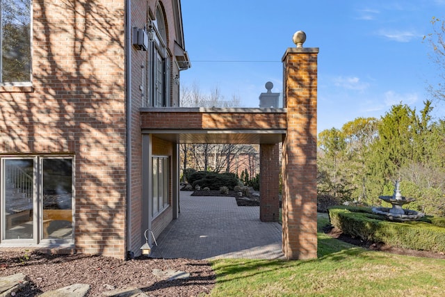 view of side of property featuring a patio area