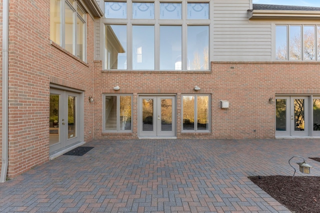 rear view of property with french doors and a patio area