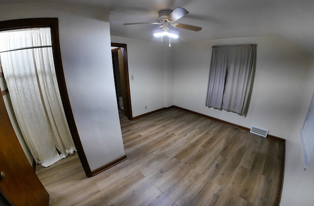 unfurnished bedroom featuring ceiling fan and light hardwood / wood-style flooring