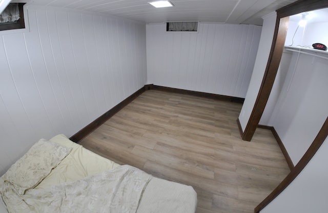 basement featuring wood-type flooring