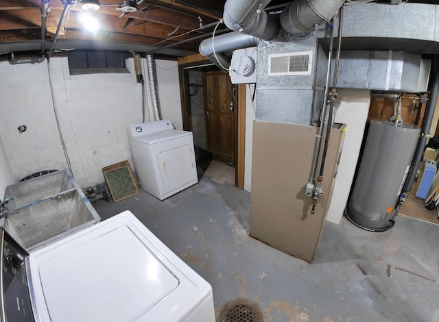 basement with separate washer and dryer and gas water heater