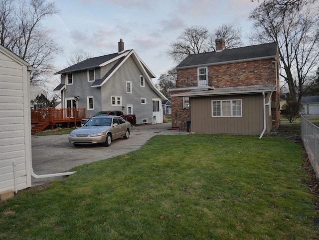 rear view of house with a lawn