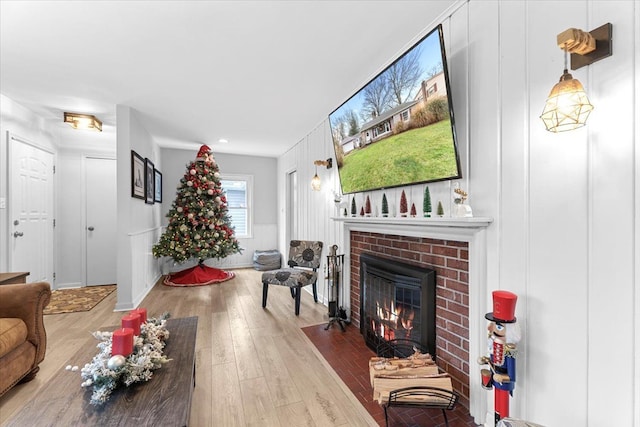 living room featuring a fireplace and hardwood / wood-style flooring