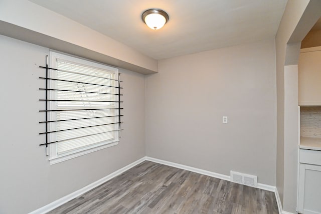 unfurnished room featuring light hardwood / wood-style floors