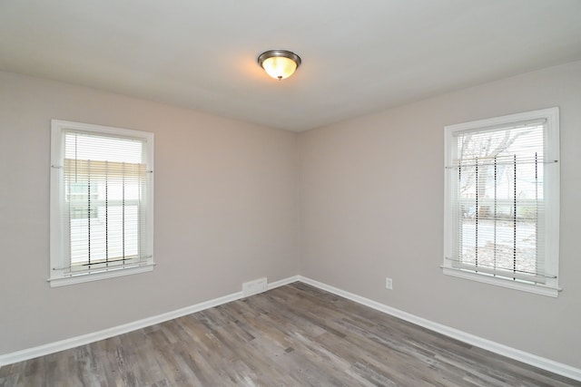 spare room featuring hardwood / wood-style floors