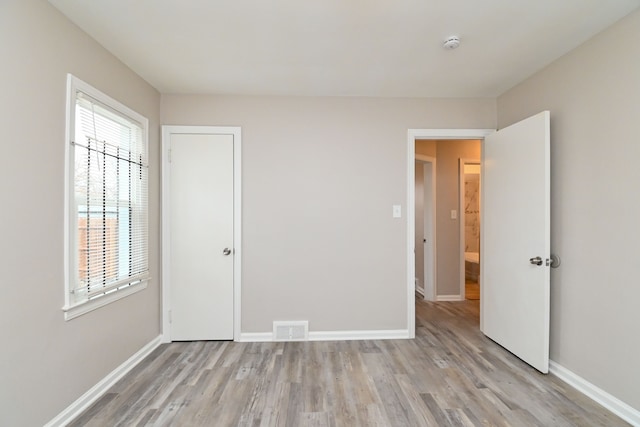 unfurnished bedroom with light hardwood / wood-style flooring