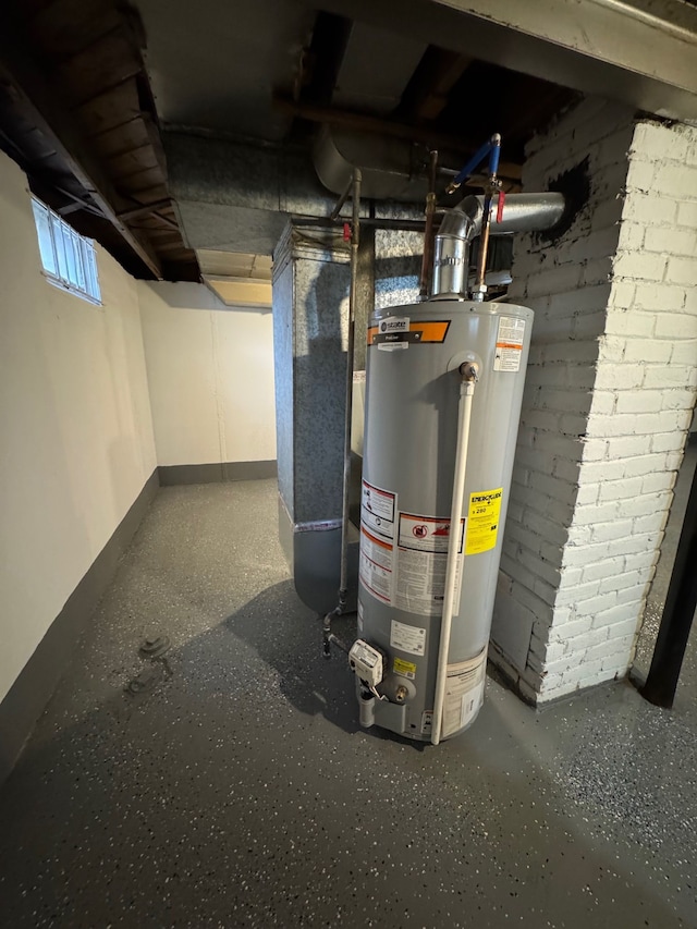 utility room featuring heating unit and gas water heater