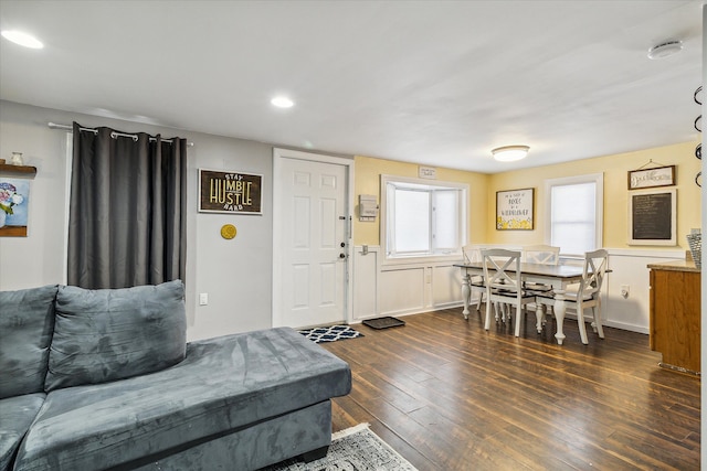 living room featuring dark wood-type flooring