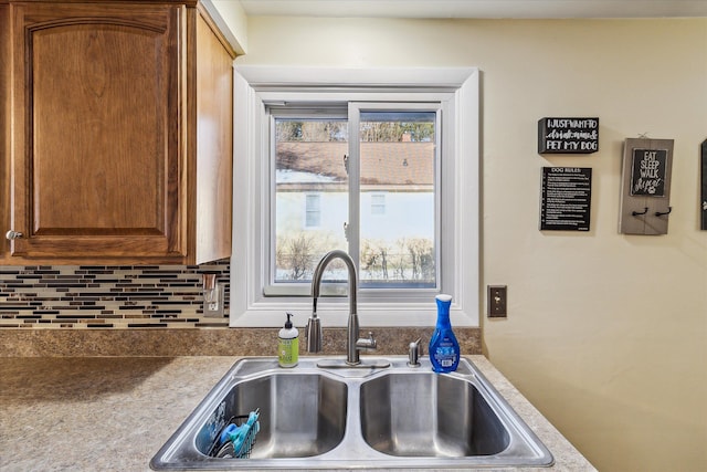 kitchen with tasteful backsplash and sink