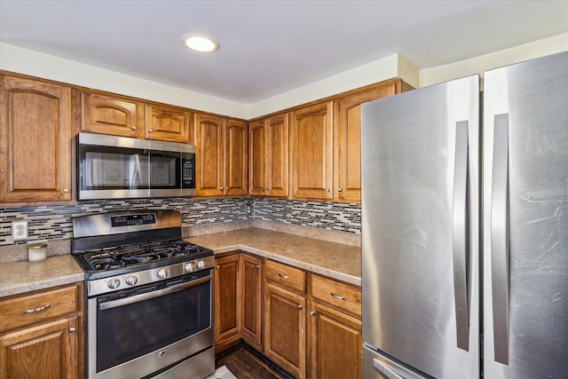 kitchen with backsplash and stainless steel appliances