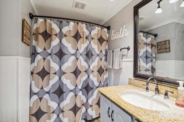 bathroom featuring vanity and crown molding