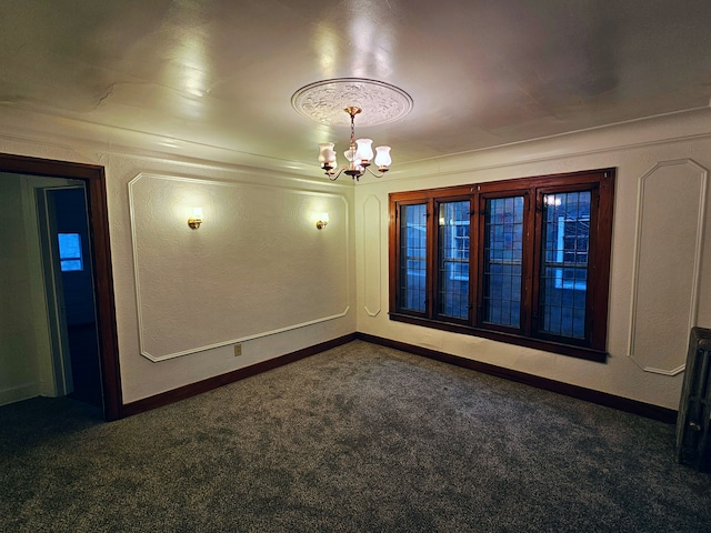 carpeted spare room featuring an inviting chandelier