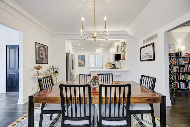 dining space with lofted ceiling, an inviting chandelier, crown molding, and dark wood-type flooring