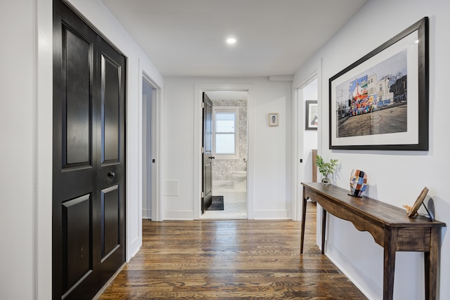 hallway with dark wood-type flooring