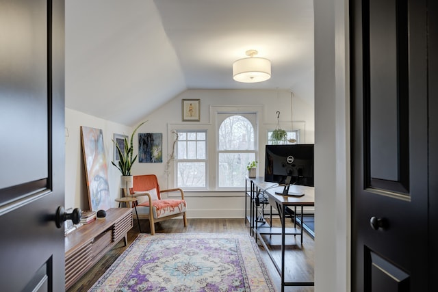 sitting room with hardwood / wood-style floors and lofted ceiling