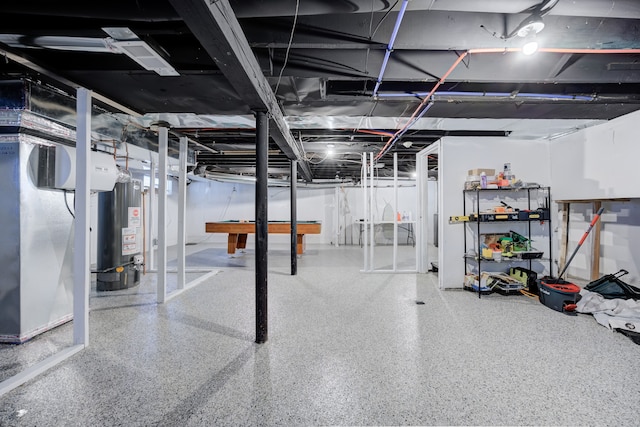 basement featuring pool table and water heater