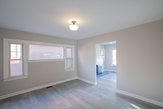 unfurnished room with light hardwood / wood-style flooring