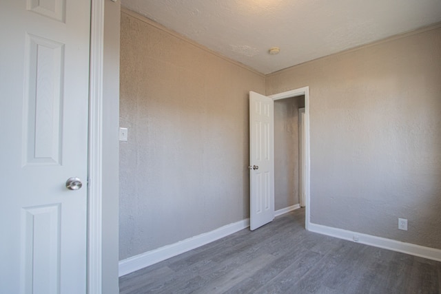 unfurnished room featuring dark hardwood / wood-style flooring