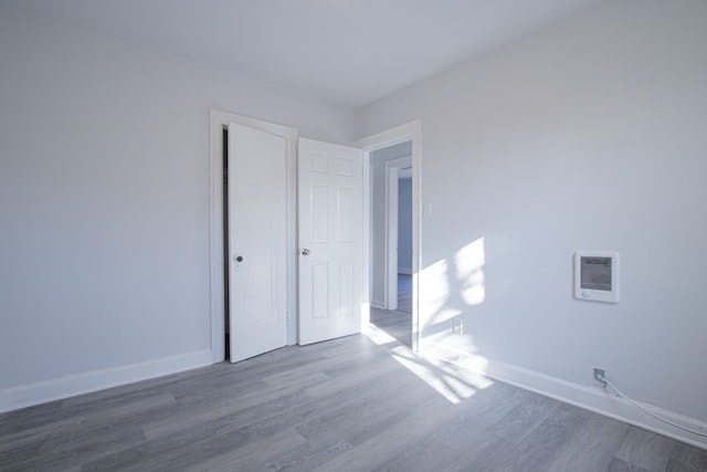 empty room with wood-type flooring