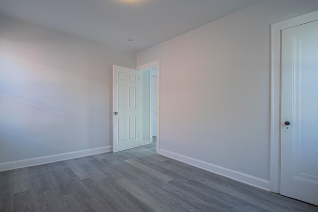 empty room with dark hardwood / wood-style floors