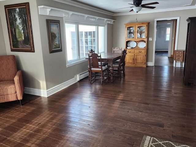 dining room with baseboard heating, crown molding, dark hardwood / wood-style flooring, and ceiling fan