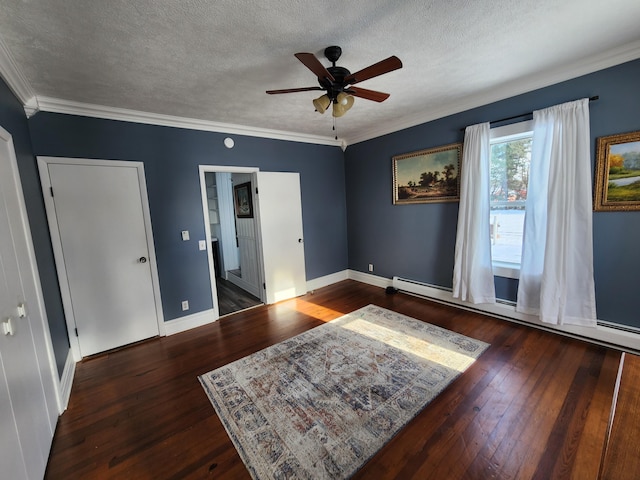 interior space with a textured ceiling, ceiling fan, a baseboard radiator, and dark hardwood / wood-style floors