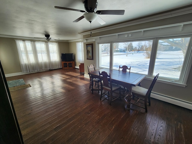 dining room featuring dark hardwood / wood-style floors, ceiling fan, ornamental molding, and a wealth of natural light