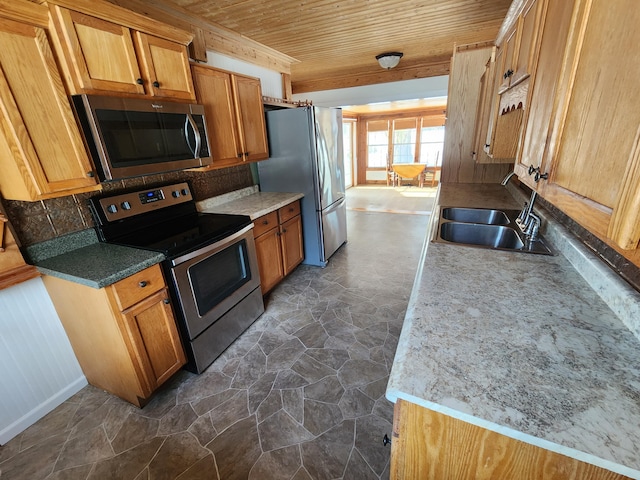 kitchen with sink, wooden ceiling, light stone counters, decorative backsplash, and appliances with stainless steel finishes