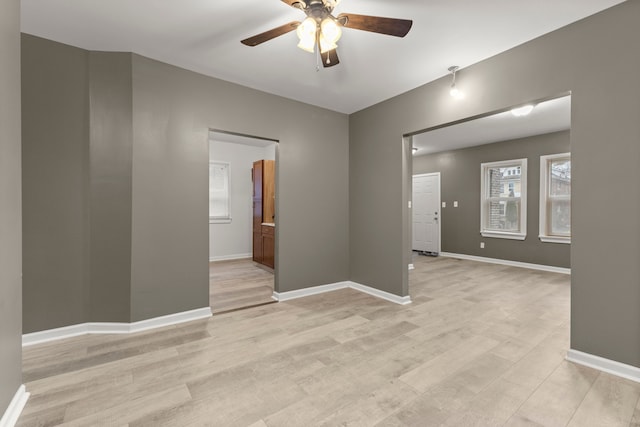 unfurnished room featuring ceiling fan and light hardwood / wood-style flooring