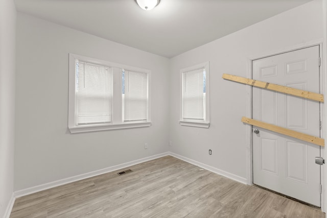 unfurnished room featuring light wood-type flooring