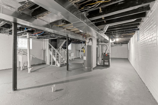 basement with heating unit and water heater