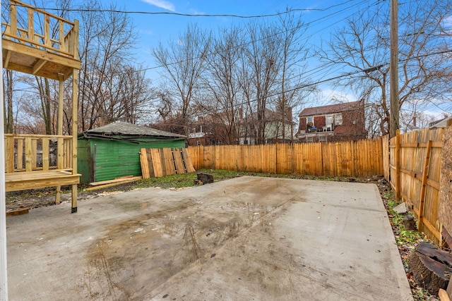 view of patio / terrace featuring an outbuilding and a deck