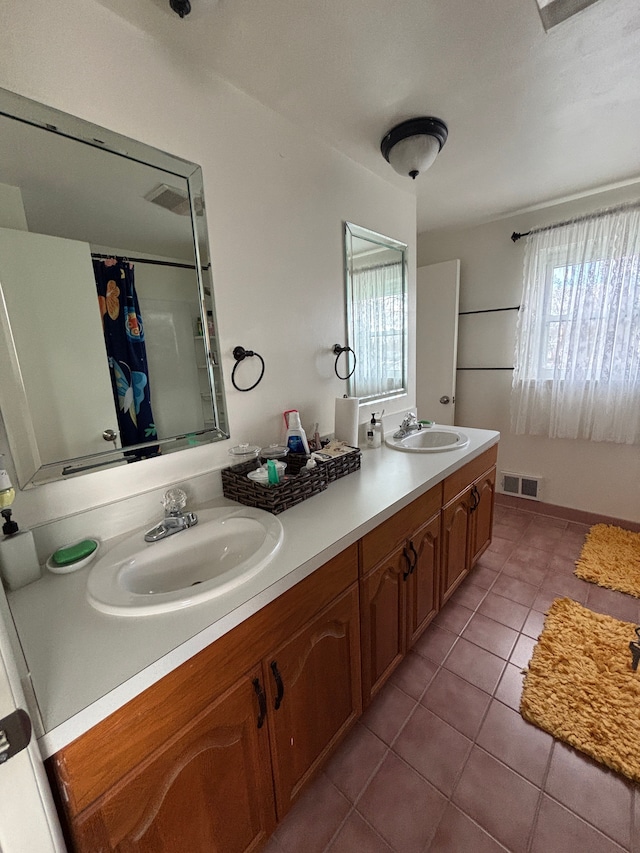 bathroom featuring a shower with curtain, tile patterned flooring, and vanity