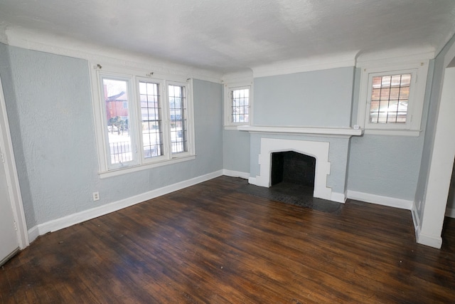 unfurnished living room with dark hardwood / wood-style flooring