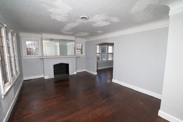 unfurnished living room featuring wood-type flooring and a textured ceiling