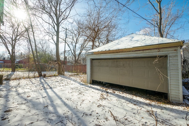 view of snow covered garage